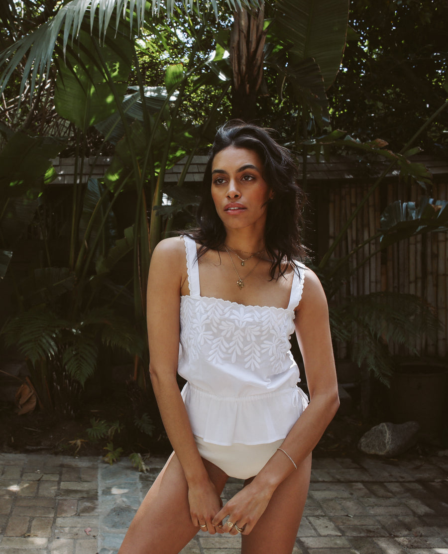 Lightweight 100% pima cotton camisole in white with white embroidered petals, delicate side covered buttons, and an adjustable drawstring waist.