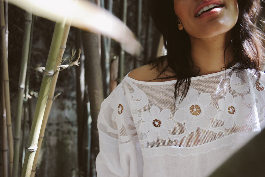 White, 100% linen short-sleeve t-shirt with a drop armhole, loose fit and appliqué  floral embroidery on a semi-sheer cotton tulle yoke.